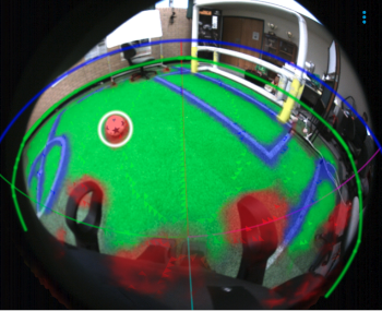 A soccer field with a segmentation overlay of different colours based on features and objects in the scene.