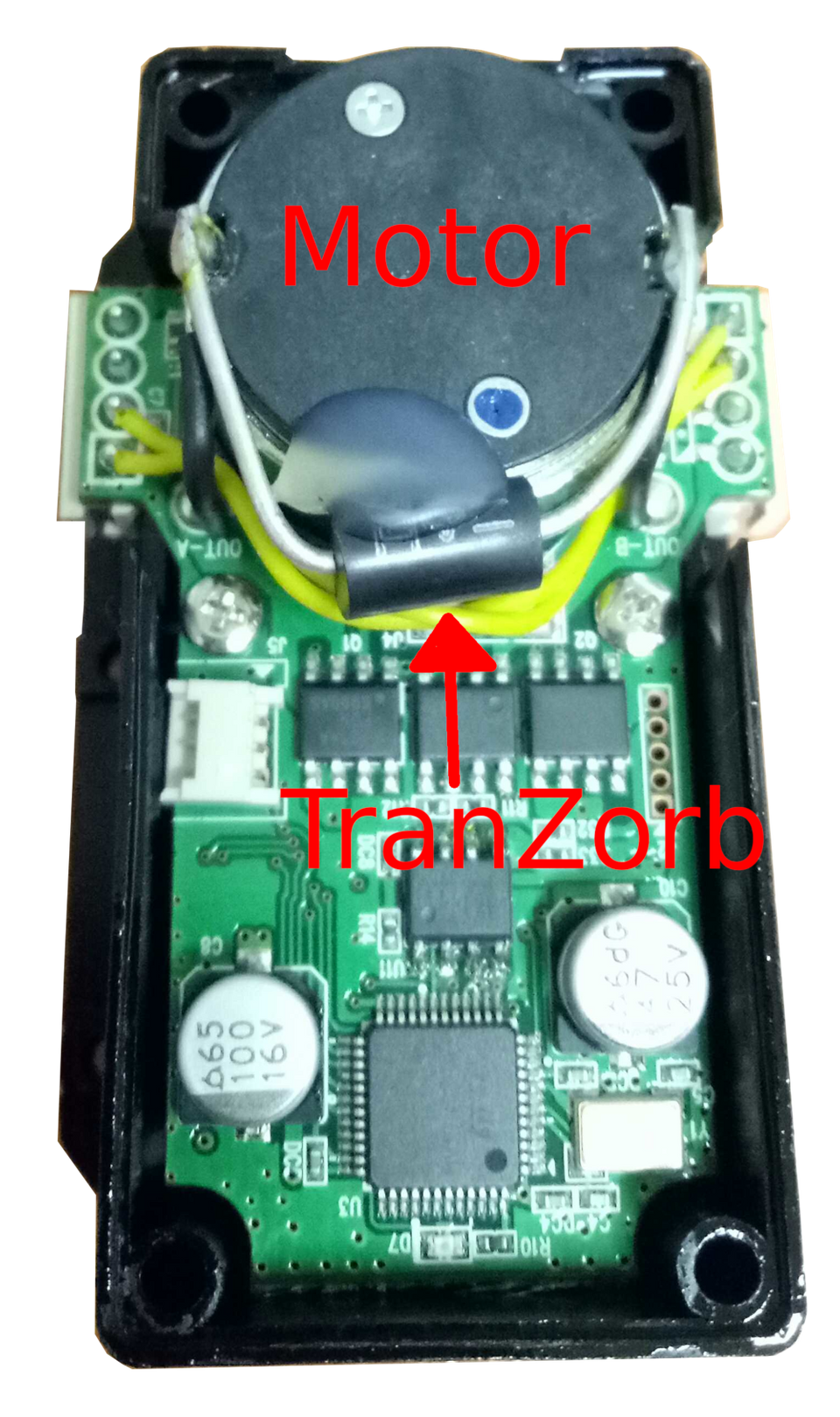 Top view of the mounted TranZorb. The two arms of the TranZorb are soldered to the motor terminals. Hot glue is added to stabilise the TranZorb against shocks and vibrations.